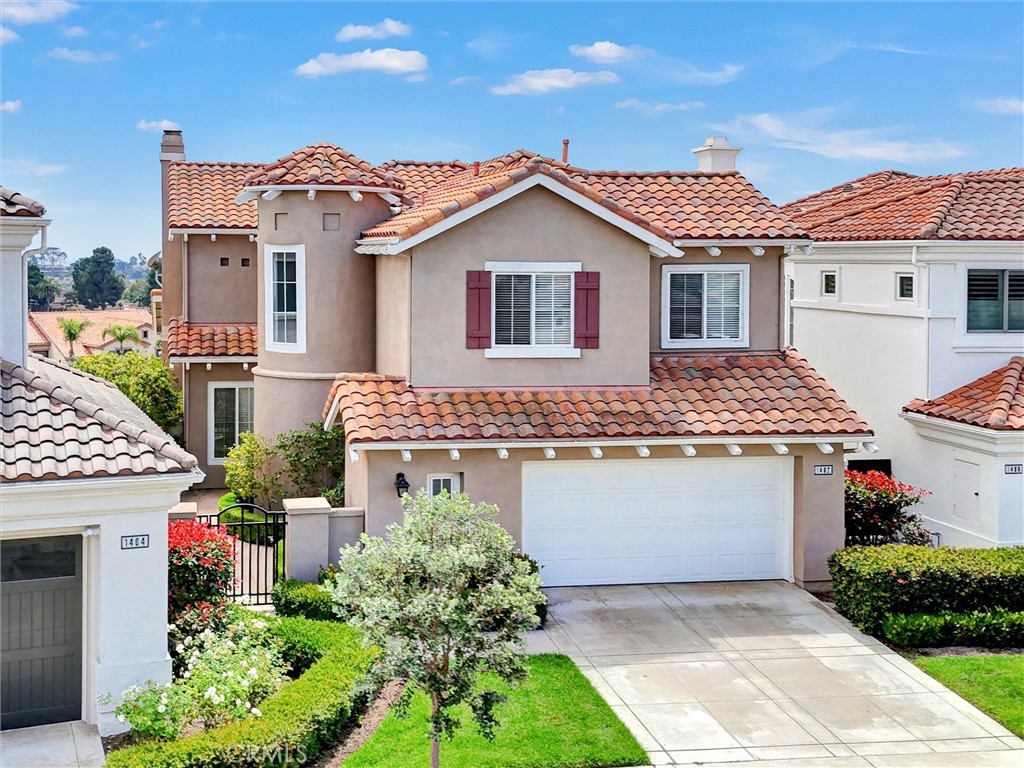 An elevated front perspective showcases the home's distinctive coastal architecture, highlighted by its elegant turret, - 1402 Sea Ridge Drive, Newport Beach CA 92660 - photo 41