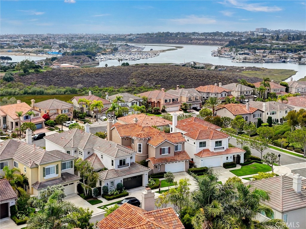 An expansive aerial perspective showcases the home's exceptional Newport Beach location, overlooking the Newport Back Ba - 1402 Sea Ridge Drive, Newport Beach CA 92660 - photo 43