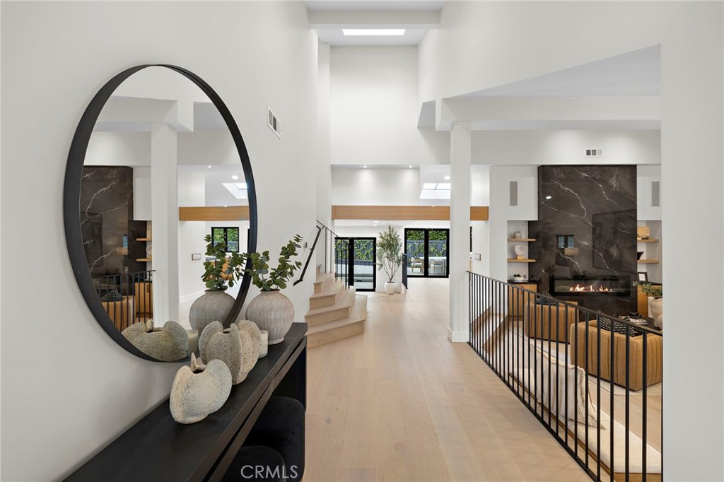 Tall ceilings plus a skylight which creates a bright and welcoming entryway - 1700 Port Ashley, Newport Beach CA 92660 - photo 7