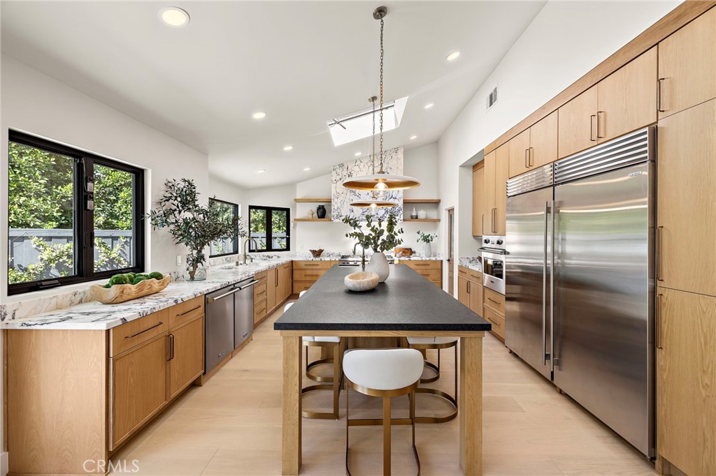 A stunning, custom-crafted chef’s kitchen that blends exceptional design with abundant custom cabinetry and a spacious w - 1700 Port Ashley, Newport Beach CA 92660 - photo 8