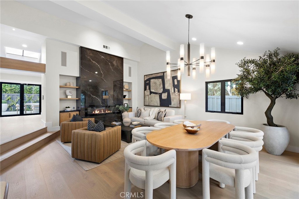Floor to ceiling electric marble fireplace, tall ceilings and abundant light - 1700 Port Ashley, Newport Beach CA 92660 - photo 11
