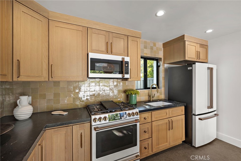Warm custom cabinetry with brand new white and gold appliances - 1700 Port Ashley, Newport Beach CA 92660 - photo 22