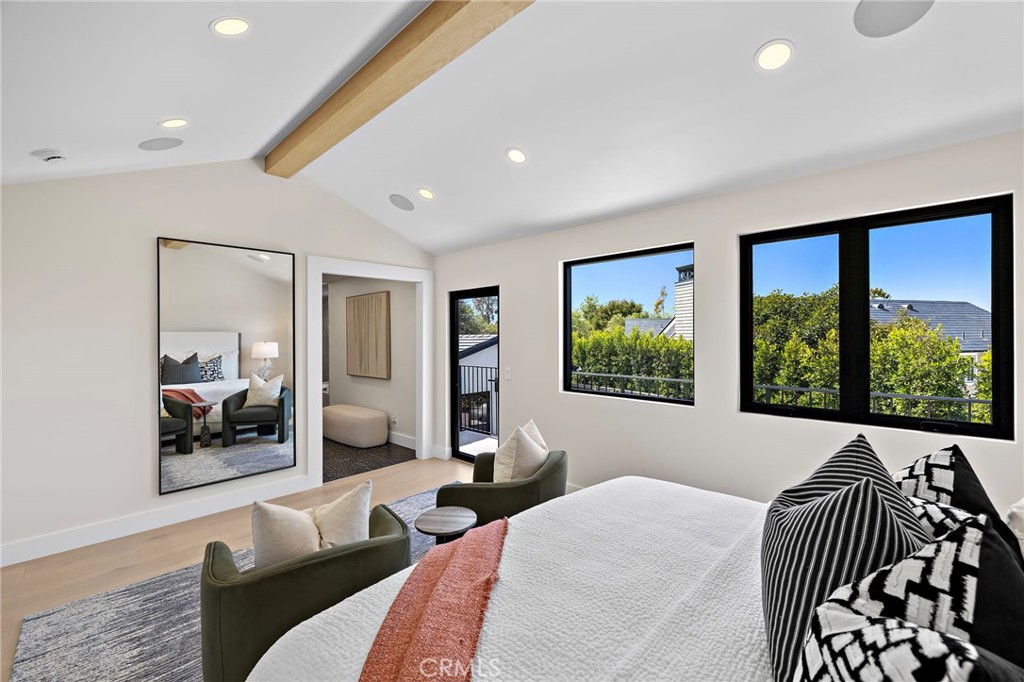 Sun drenched Primary bedroom with beamed ceiling and views of mountains from the private balcony - 1700 Port Ashley, Newport Beach CA 92660 - photo 26
