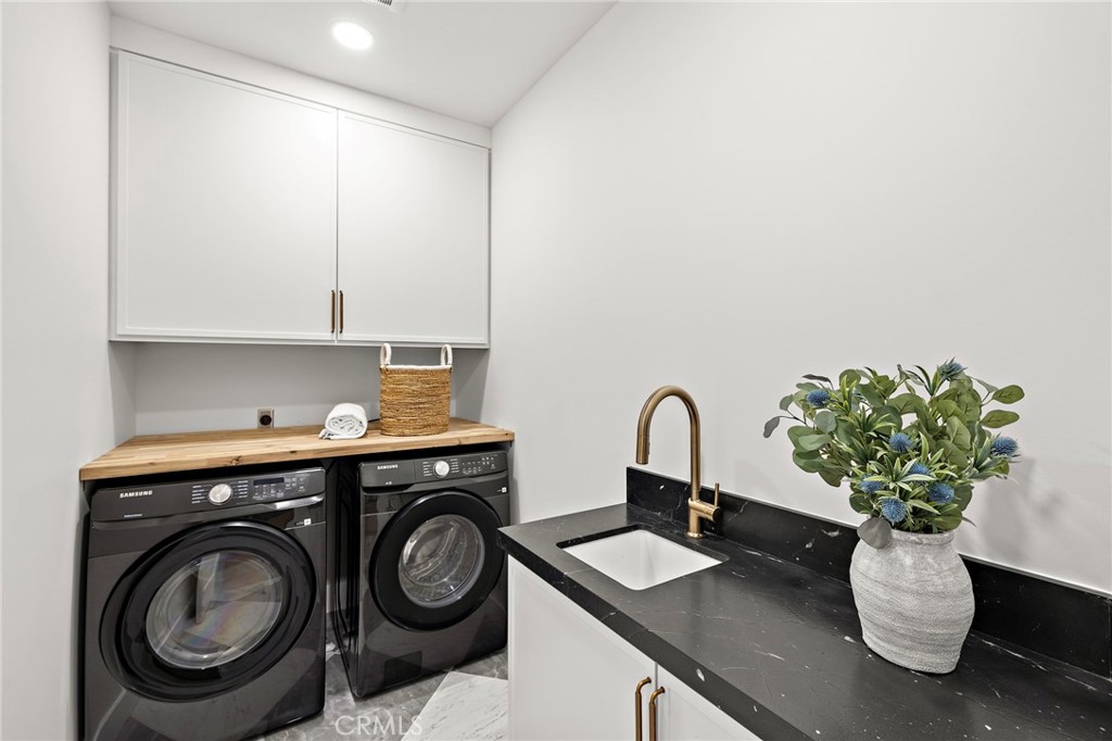 Upstairs laundry room with sink and storage - 1700 Port Ashley, Newport Beach CA 92660 - photo 33