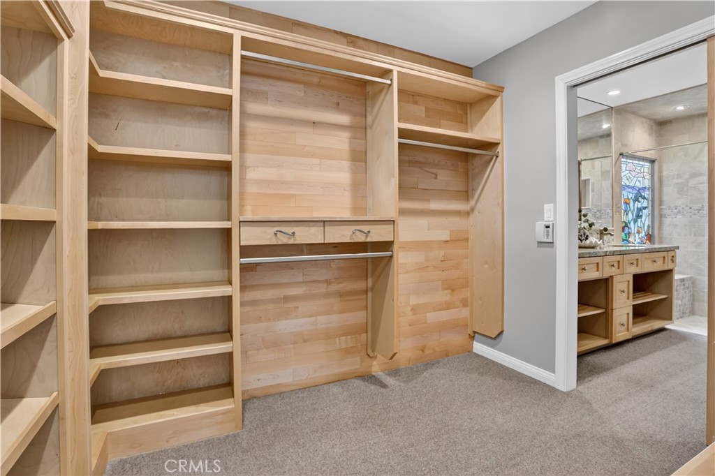 Custom walk in closet complete with high end maple cabinetry - 1706 E Ocean Boulevard, Newport Beach CA 92661 - photo 33