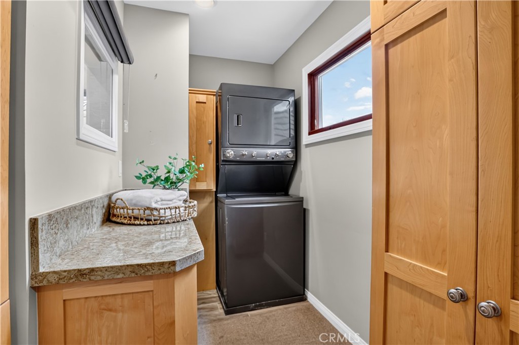 Convenient upstairs laundry room with peak a boo ocean view - 1706 E Ocean Boulevard, Newport Beach CA 92661 - photo 38