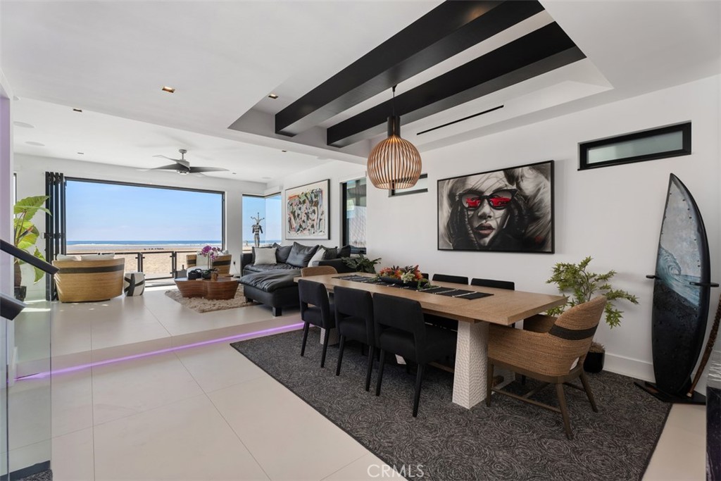 View from the kitchen through the dining room to the view - 1904 W Oceanfront, Newport Beach CA 92663 - photo 9