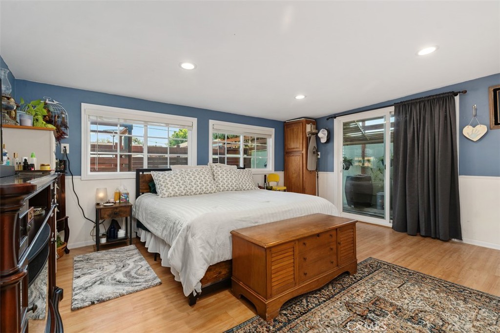 Primary bedroom with sliders to the side yard. - 20292 RIVERSIDE, Newport Beach CA 92660 - photo 20