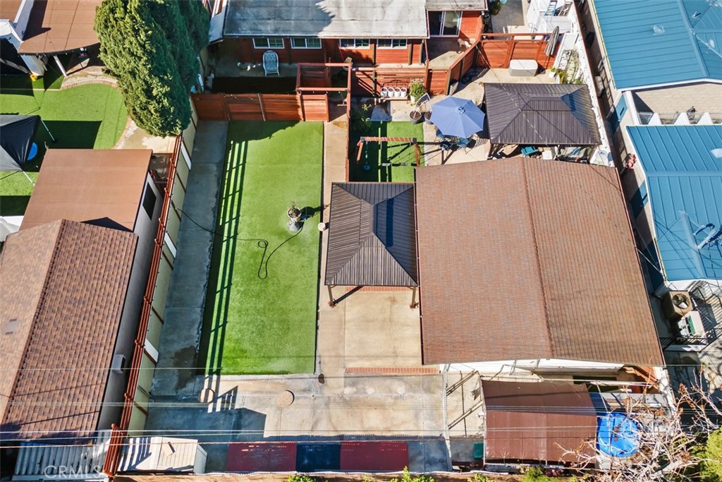 Aerial of outdoor "play" area, garage, entertainment area and shed. - 20292 RIVERSIDE, Newport Beach CA 92660 - photo 38