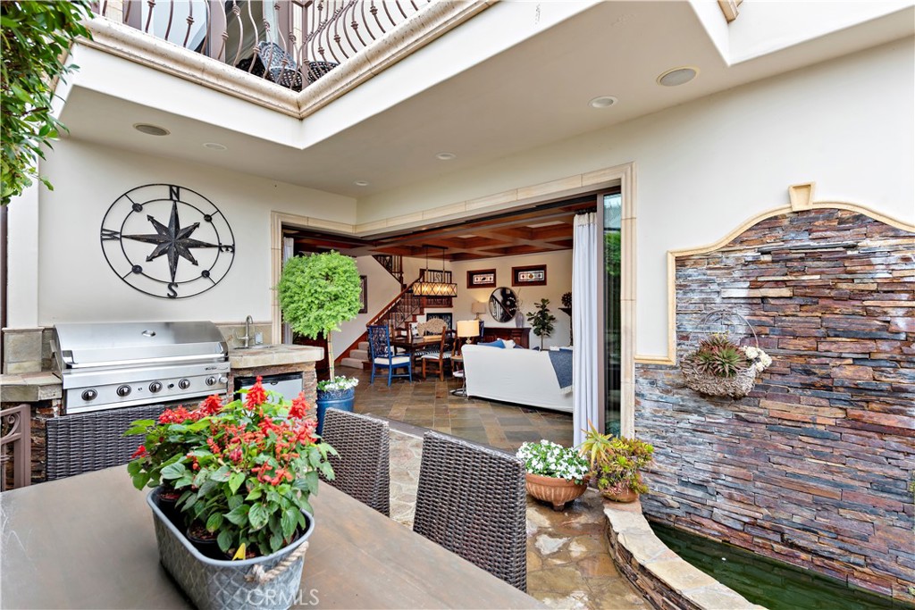 open disappearing doors courtyard - 2038 Miramar Drive, Newport Beach CA 92661 - photo 8