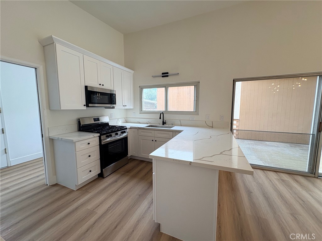 Remodeled kitchen with quartz counters - 20452 SW Cypress, Newport Beach CA 92660 - photo 3