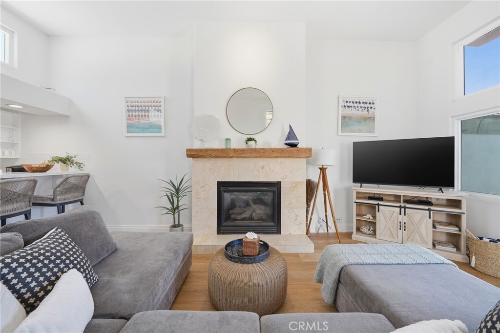Unit A: Living room area with fireplace - 2202 W Oceanfront, Newport Beach CA 92663 - photo 6