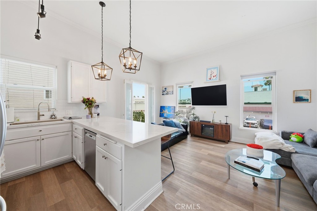 Unit D: Kitchen with loft area. - 2202 W Oceanfront, Newport Beach CA 92663 - photo 17