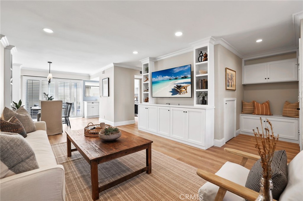 Living room with built in storage and TV wall - 2209 Vista Huerta, Newport Beach CA 92660 - photo 1