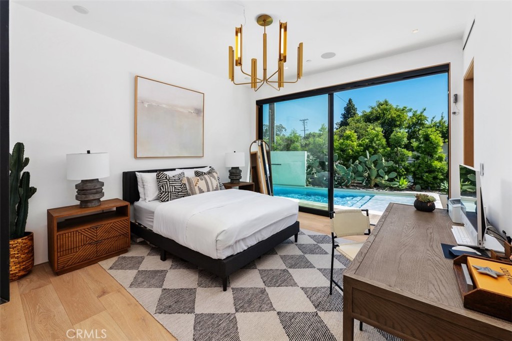 Third bedroom on mail level with effortless access to pool and outdoor fireplace - 2398 Redlands Drive, Newport Beach CA 92660 - photo 21
