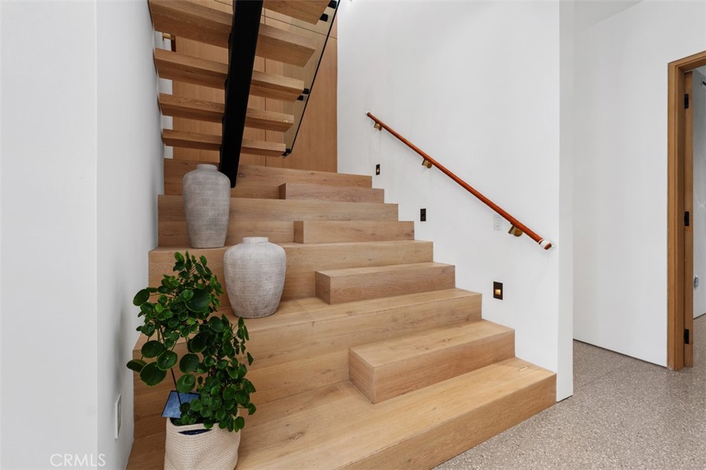 Beautiful Oak staircase and hand wrapped leather hand rails leads to second level - 2398 Redlands Drive, Newport Beach CA 92660 - photo 23