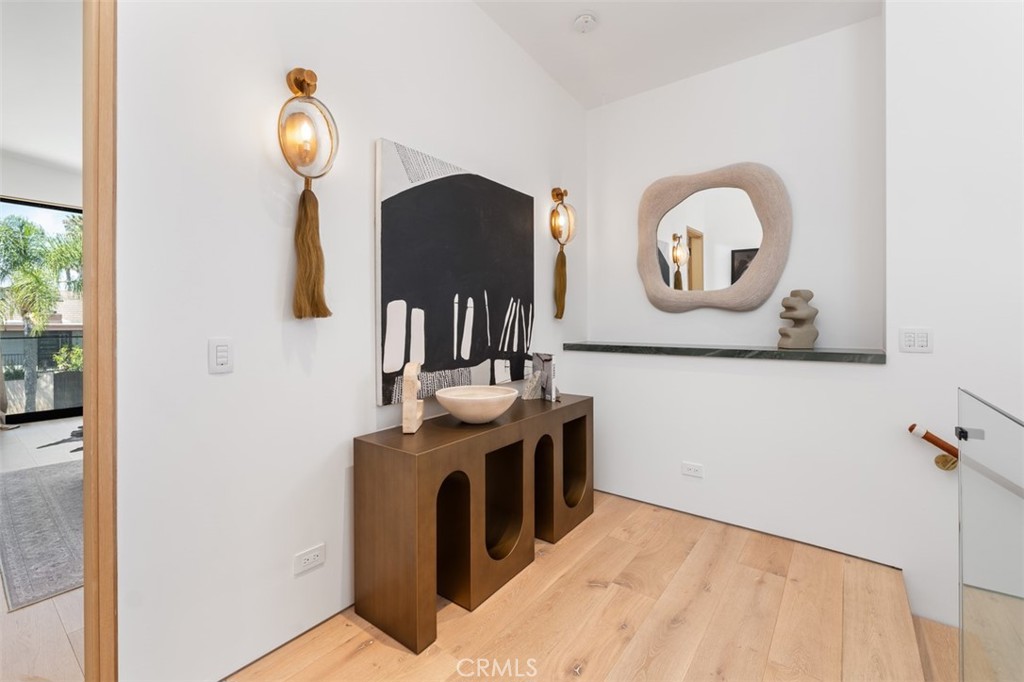 Upstairs hallway with bespoke light fixtures mimic horse tail - 2398 Redlands Drive, Newport Beach CA 92660 - photo 24