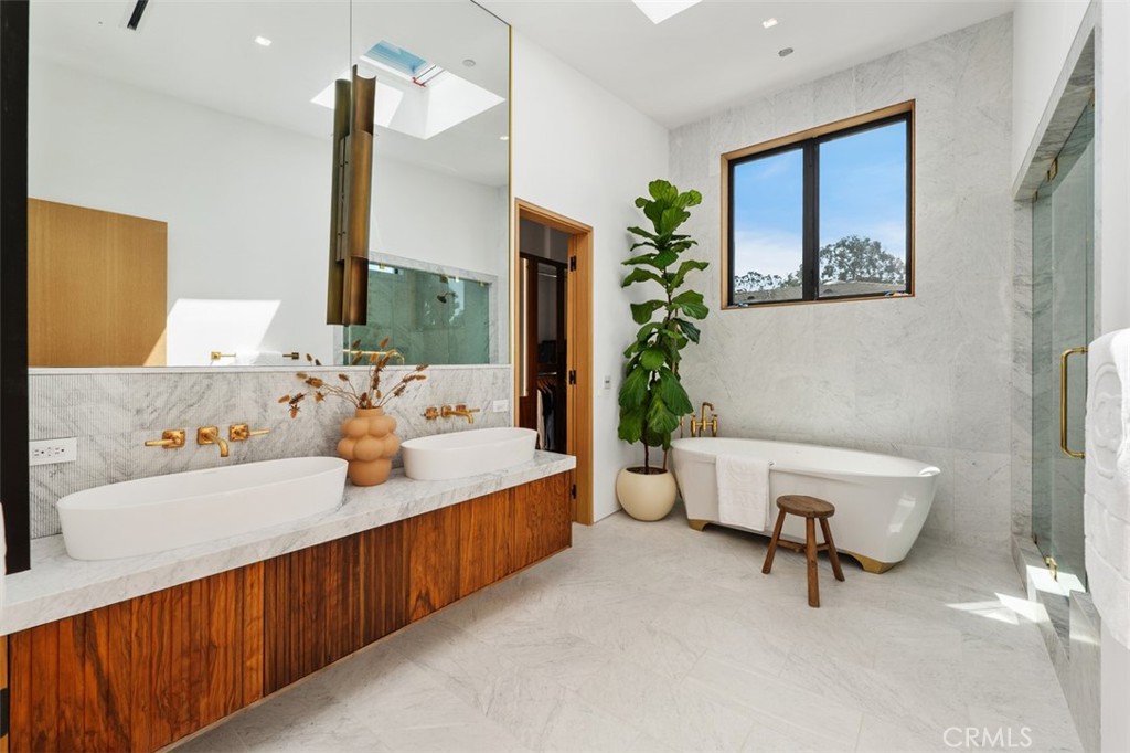 En-suite with Italian marble, skylight, soaking tub, shower and brass fixtures - 2398 Redlands Drive, Newport Beach CA 92660 - photo 26