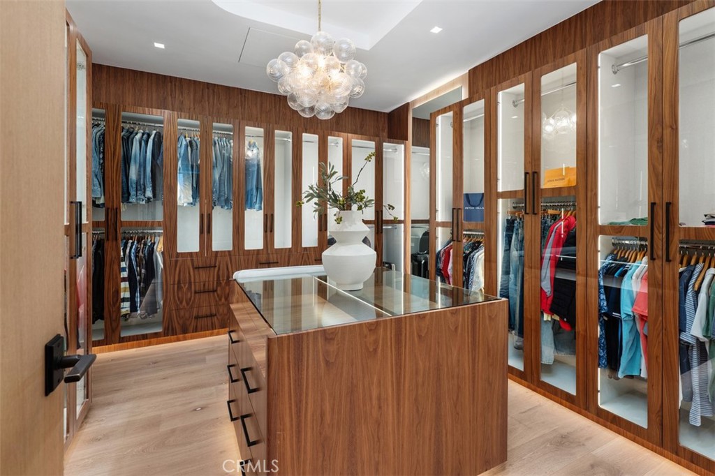 The walk in closet everyone dreams about with custom light fixture - 2398 Redlands Drive, Newport Beach CA 92660 - photo 32