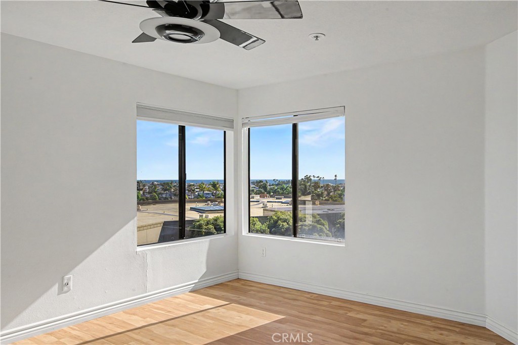 Primary bedroom on the corner looking out to the ocean and the harbor. - 280 Cagney Lane 207, Newport Beach CA 92663 - photo 13
