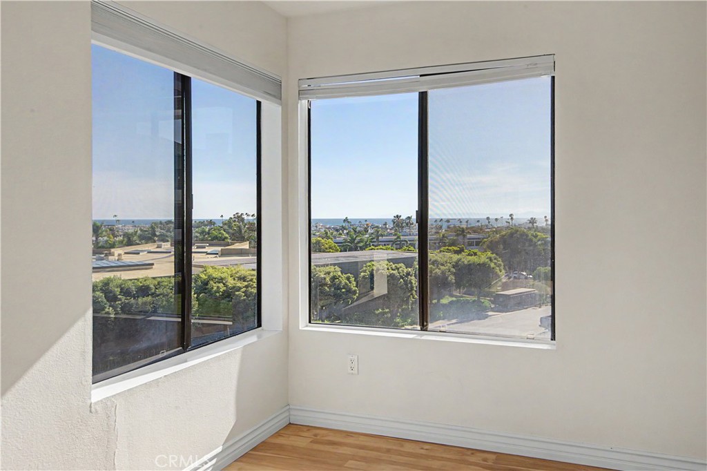 Primary bedroom on the corner looking out to the ocean and the harbor. - 280 Cagney Lane 207, Newport Beach CA 92663 - photo 14