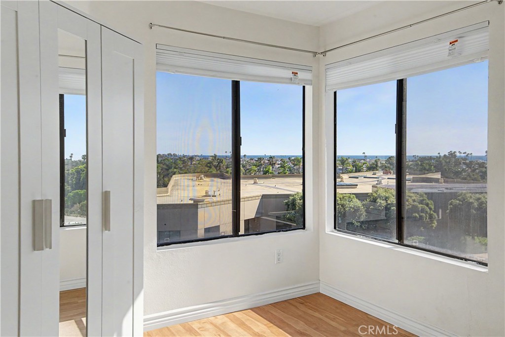 Double-door second bedroom looks to ocean and harbor and also make a great home office. - 280 Cagney Lane 207, Newport Beach CA 92663 - photo 19