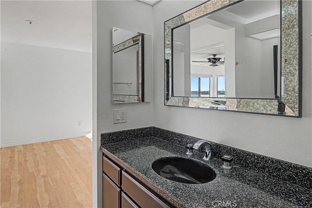 Larger primary bath sink area has lots of counter space. - 280 Cagney Lane 207, Newport Beach CA 92663 - photo 21