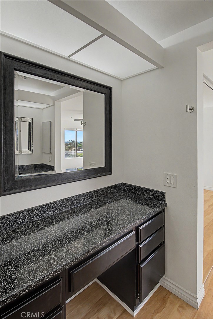 Larger primary bath sink area has lots of counter space. - 280 Cagney Lane 207, Newport Beach CA 92663 - photo 22
