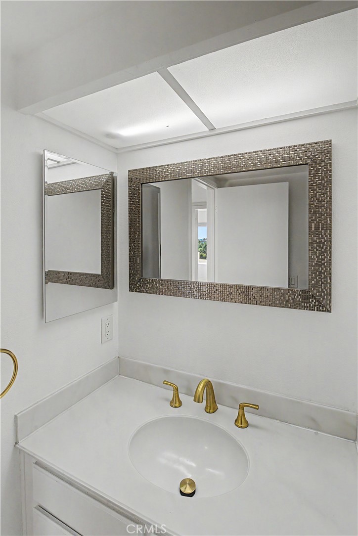 Bathroom has an additional 1/4 bath sink area to make sharing more convenient. - 280 Cagney Lane 207, Newport Beach CA 92663 - photo 24