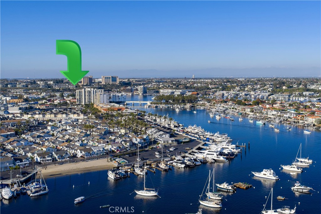 Unit 207's front-row end-unit looks out to the harbor and the ocean. - 280 Cagney Lane 207, Newport Beach CA 92663 - photo 27