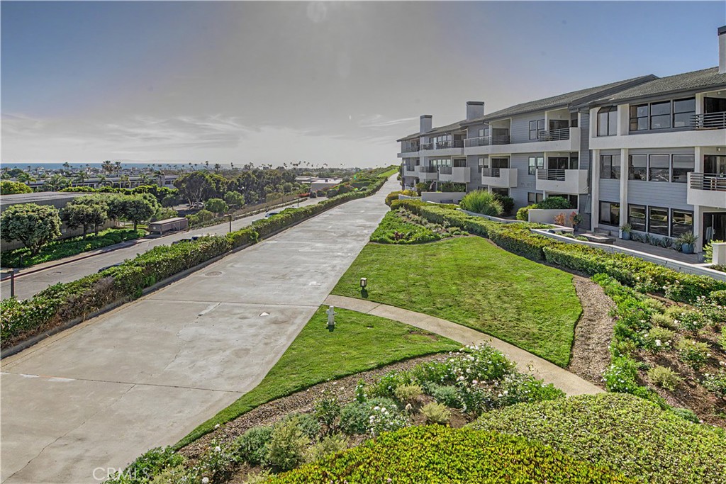 Step right outside your unit to the path to the ocean and peninsula. - 280 Cagney Lane 207, Newport Beach CA 92663 - photo 35
