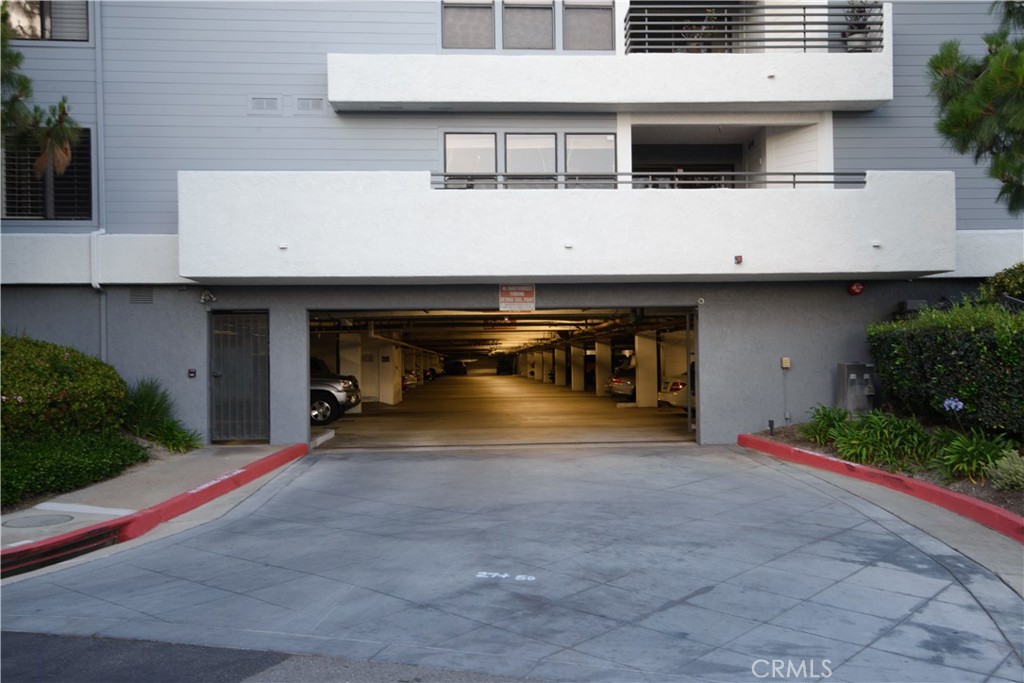 Gated secure parking garage below. - 280 Cagney Lane 207, Newport Beach CA 92663 - photo 47