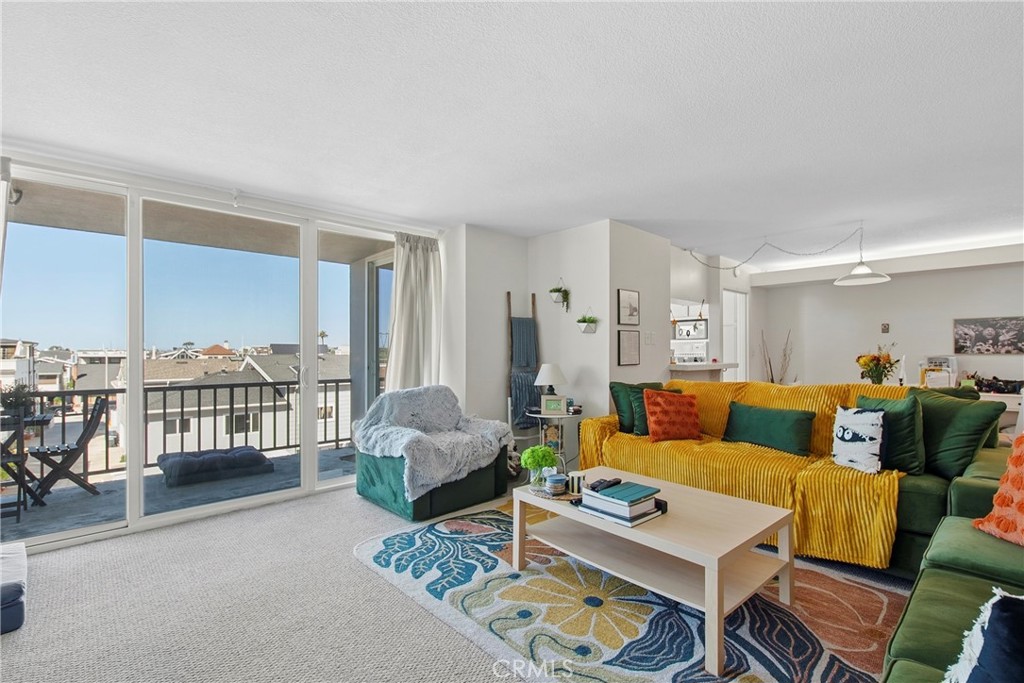 Living room with sliders to the balcony - 310 Fernando Street 208, Newport Beach CA 92661 - photo 2