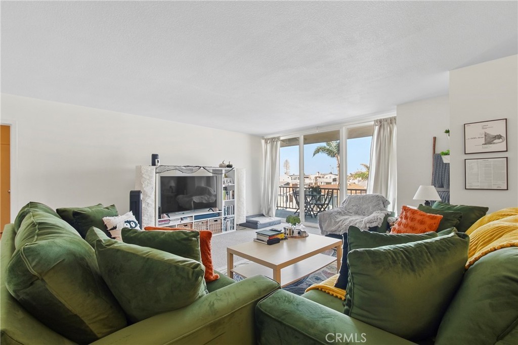 Living room toward the balcony - 310 Fernando Street 208, Newport Beach CA 92661 - photo 5