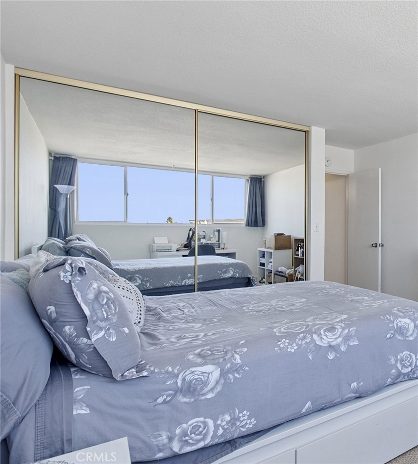 Second bedroom with mirrored closet - 310 Fernando Street 208, Newport Beach CA 92661 - photo 17