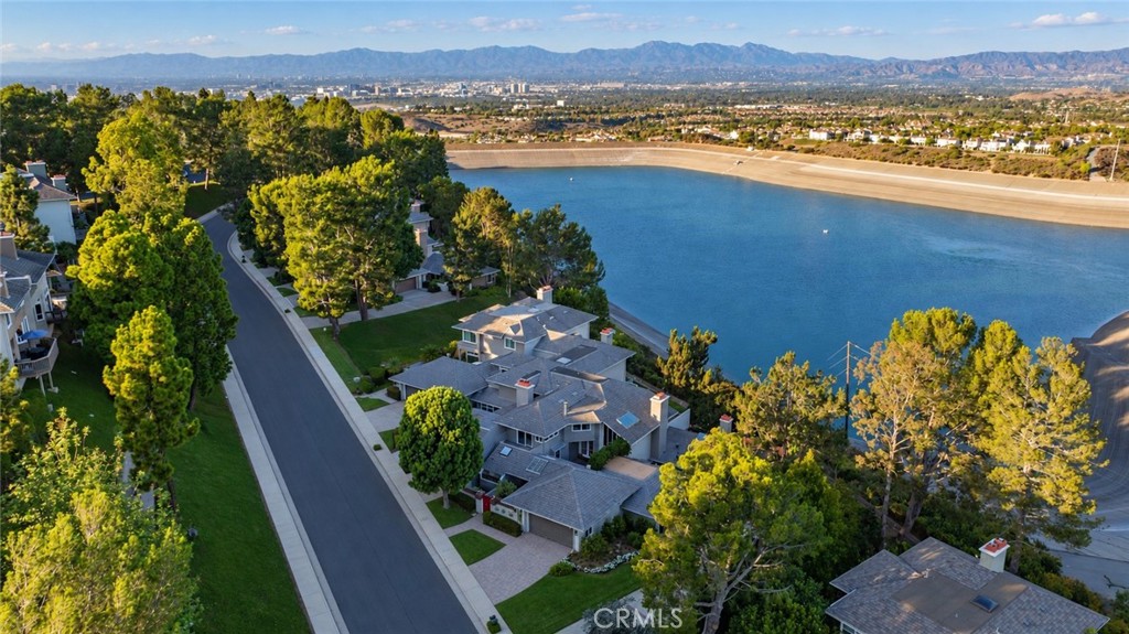 Front Aerial showing the San Joaquin Reservoir and Mountains in the distance. Virtually enhanced - 36 Vienna, Newport Beach CA 92660 - photo 2