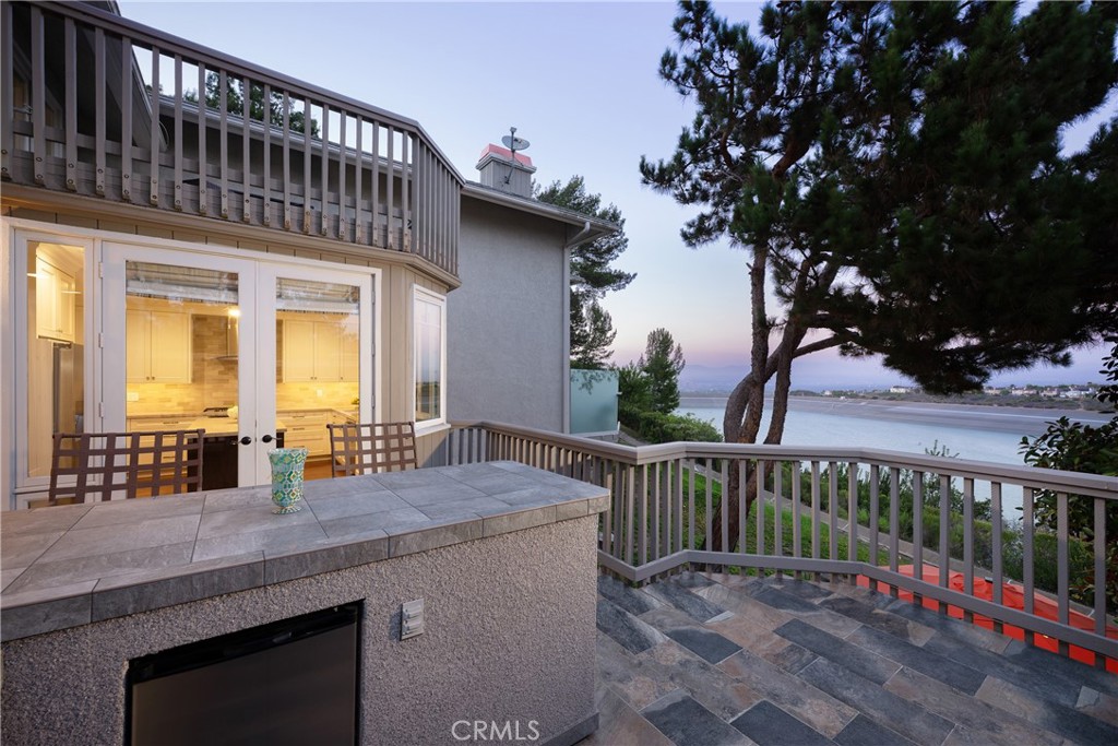 View Deck: Elevated outdoor deck with direct access from the kitchen and a built-in counter area. Enjoy expansive reserv - 36 Vienna, Newport Beach CA 92660 - photo 10