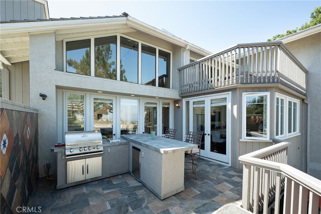 Outdoor Kitchen & Deck: Spacious deck is designed for outdoor entertaining with a built-in stainless steel grill, counte - 36 Vienna, Newport Beach CA 92660 - photo 12