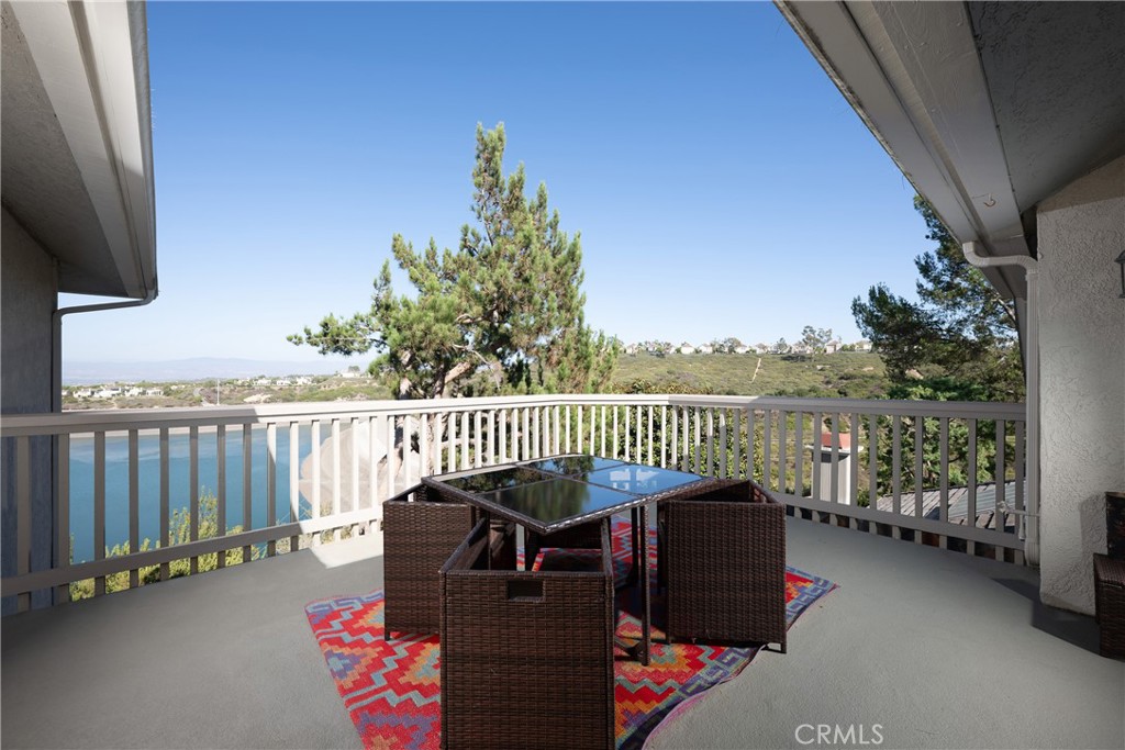 Upper-Level Deck: Private deck provides space for outdoor dining while overlooking the surrounding hillside and reservoi - 36 Vienna, Newport Beach CA 92660 - photo 29