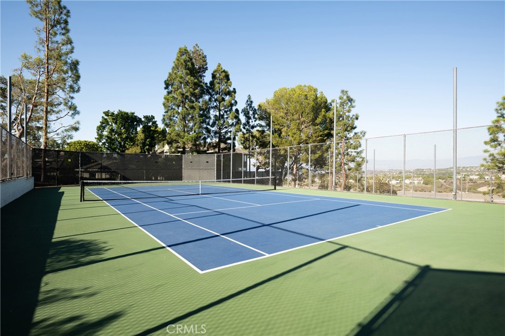 Community Tennis Court: Another view of the tennis court highlights the full playing surface and open hillside surroundi - 36 Vienna, Newport Beach CA 92660 - photo 36
