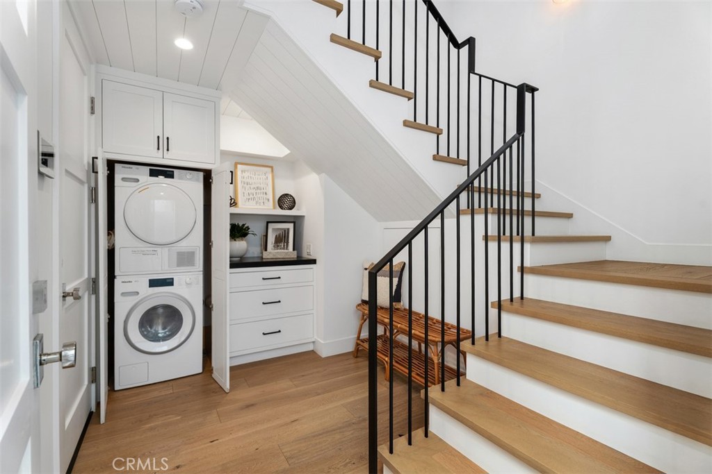 First level entry with washer and dryer closet and under stair storage - 418 1/2 Larkspur, Newport Beach CA 92625 - photo 5