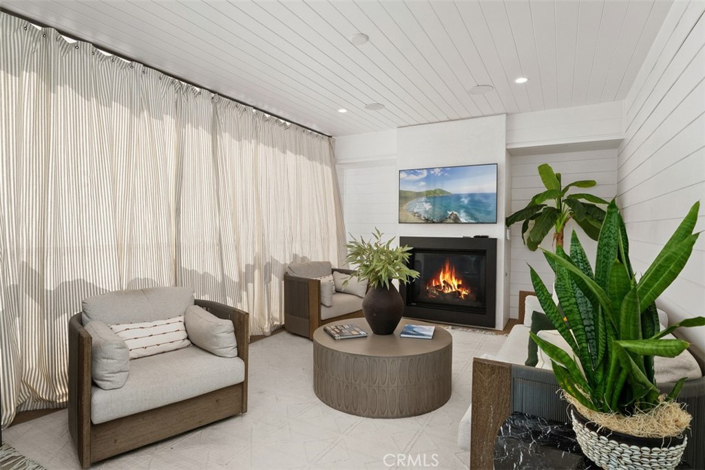 Second Floor Patio with ceramic faux wood tile with TV and fireplace with privacy curtains (TV and Fireplace modified fo - 418 1/2 Larkspur, Newport Beach CA 92625 - photo 21