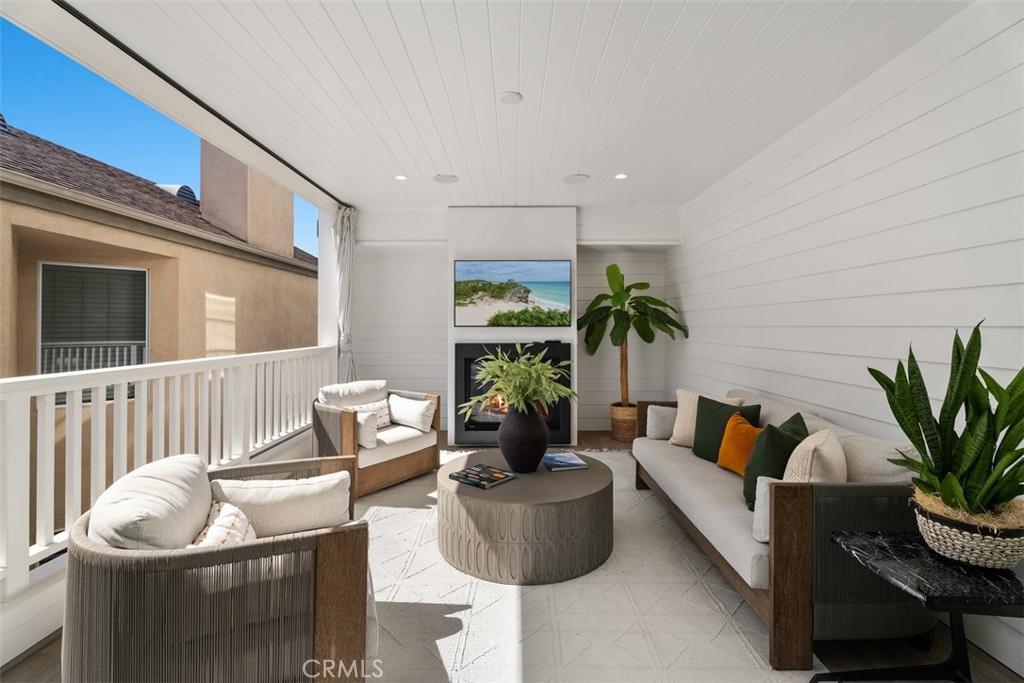 Second Floor patio with recessed lighting (TV and fireplaced modified for photo) - 418 1/2 Larkspur, Newport Beach CA 92625 - photo 22
