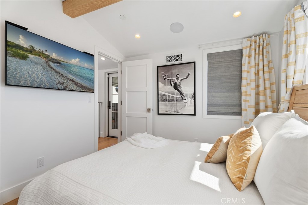 Secondary Bedroom with automatic shades, curtains and TV (TV modified for photo) - 418 1/2 Larkspur, Newport Beach CA 92625 - photo 27
