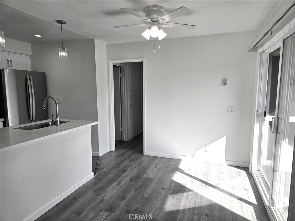 Dining room area with Light and Ceiling Fan next to kitchen and outdoor patio/deck - 4233 Hilaria, Newport Beach CA 92663 - photo 3