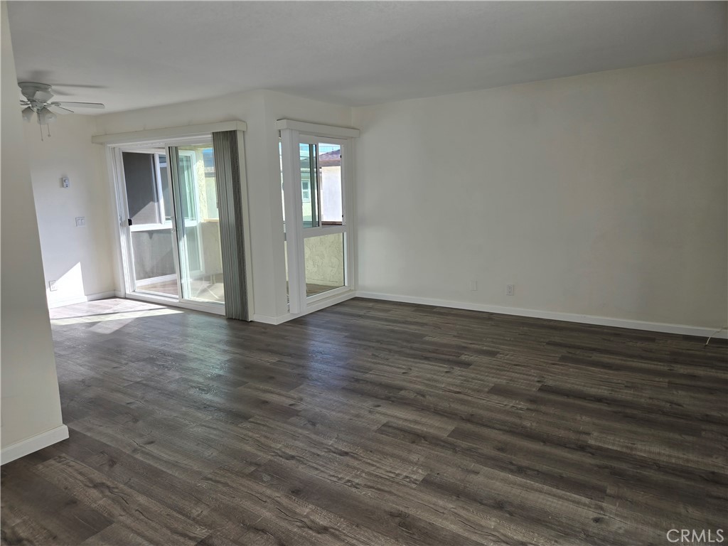 View of living room into Dining room and slider door access to patio/deck - 4233 Hilaria, Newport Beach CA 92663 - photo 7