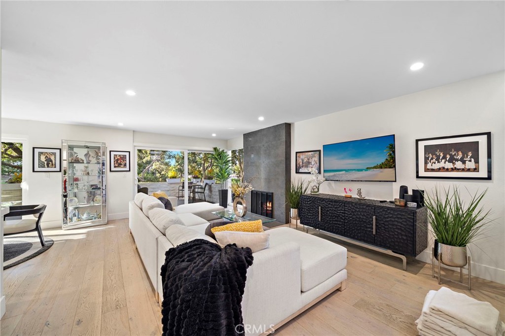 Open floor plan, modern gas fireplace & gorgeous view of the greenbelt. Very private and close to the park and walking t - 526 Vista Grande, Newport Beach CA 92660 - photo 4