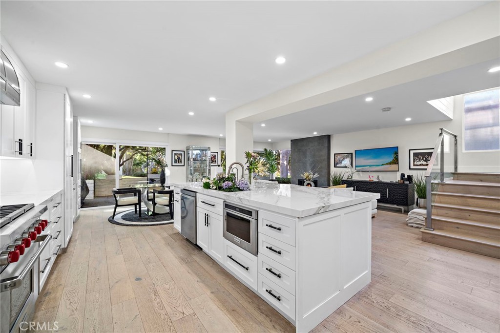 TCome down the glass staircase to the large entertaining space. There is an additional high-end microwave build in the i - 526 Vista Grande, Newport Beach CA 92660 - photo 12