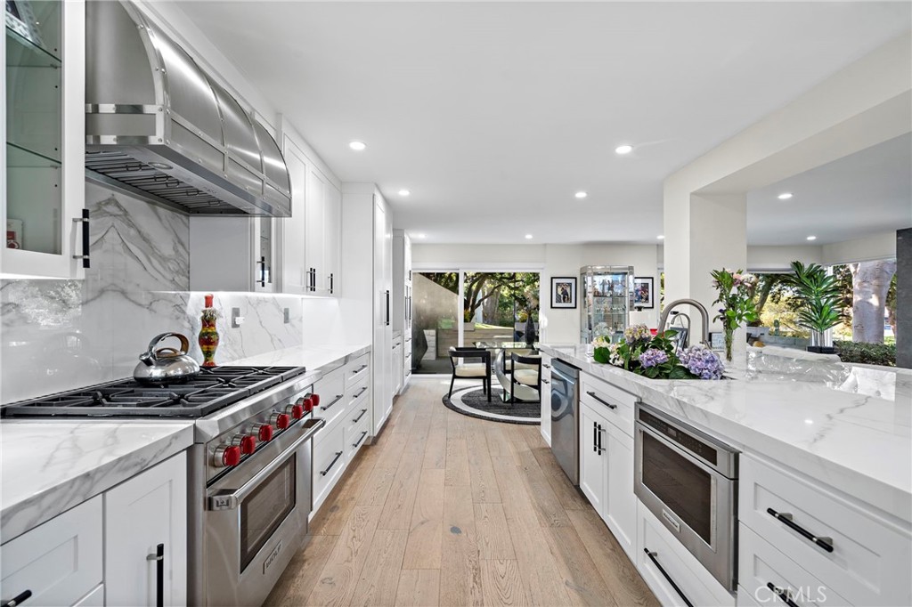 Entertaining is easy with the multiple oven's & microwaves. Gorgeous views through the glass doors of the greenbelt. - 526 Vista Grande, Newport Beach CA 92660 - photo 13