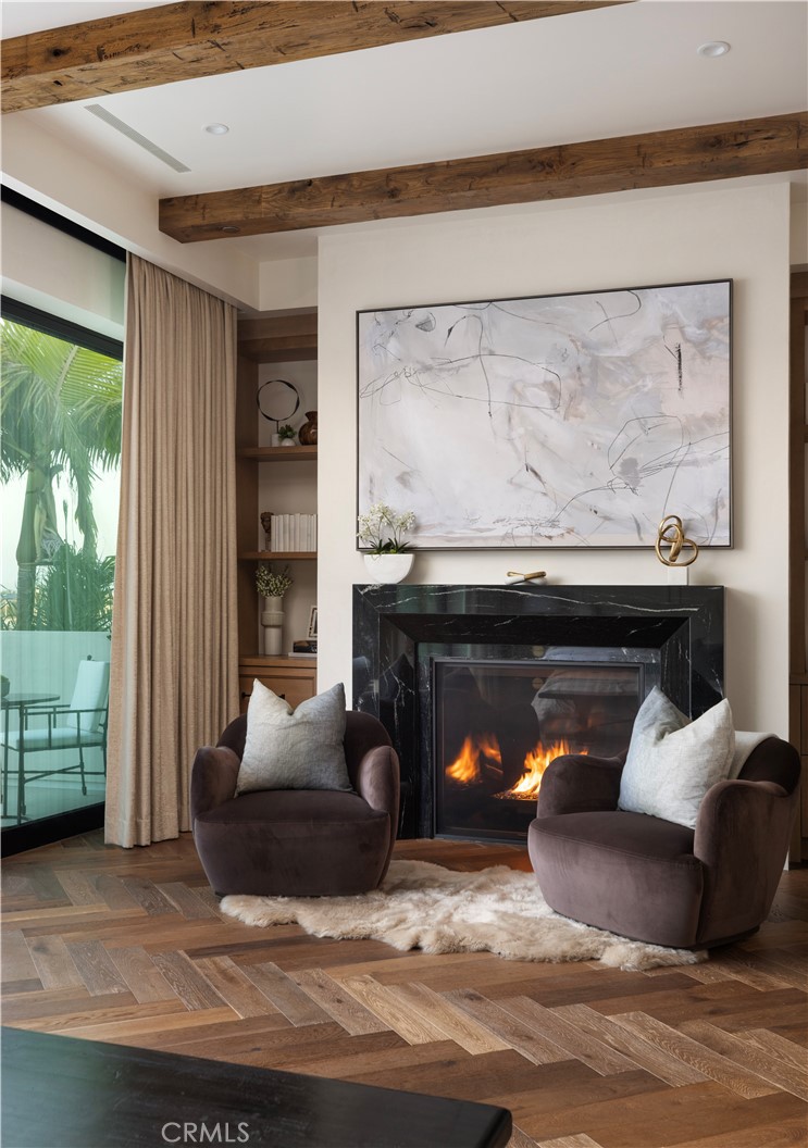 Primary suite with custom Nero Lactea marble fireplace. - 615 Lido Park, Newport Beach CA 92663 - photo 11